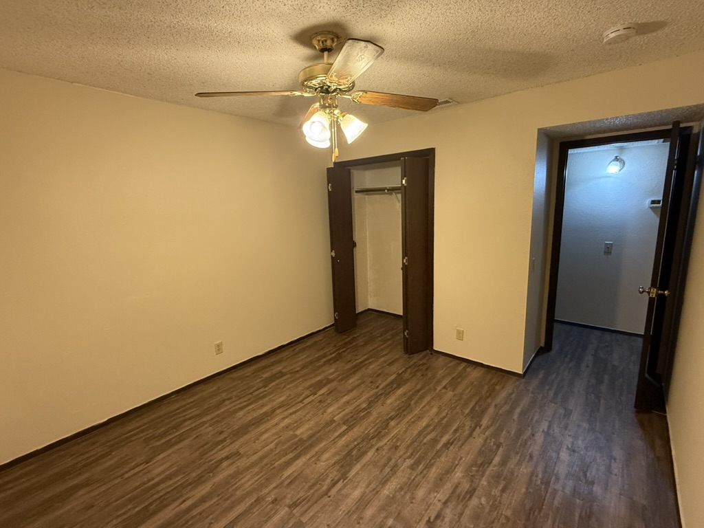 907 East Meadowmere Lane Austin, TX 78758 - Photo 19 of 23 a view of an empty room with wooden floor