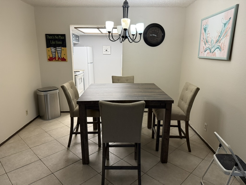 907 East Meadowmere Lane Austin, TX 78758 - Photo 6 of 23 a view of a dining room with furniture and wooden floor