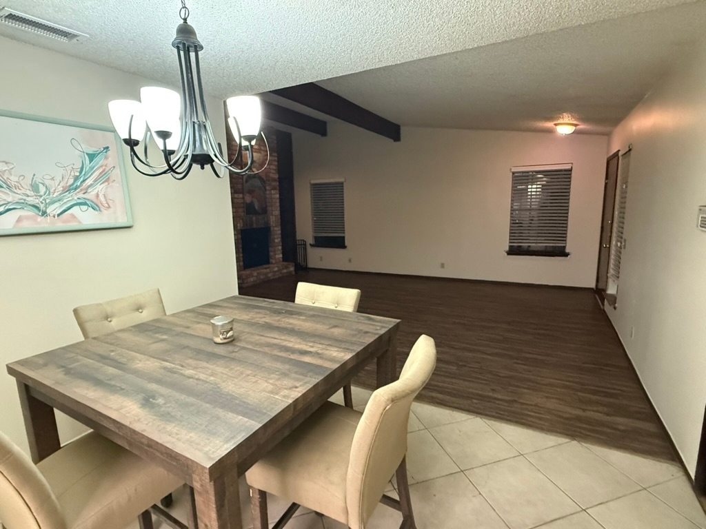 907 East Meadowmere Lane Austin, TX 78758 - Photo 7 of 23 a dining room with a table and chairs