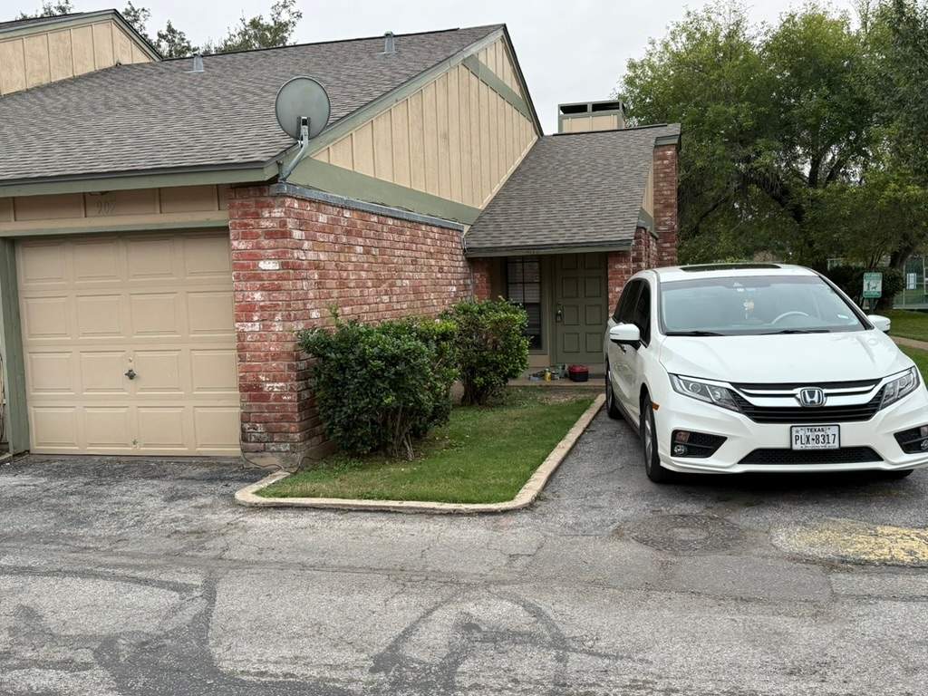 907 East Meadowmere Lane Austin, TX 78758 - Photo 8 of 23 a car parked in front of a house