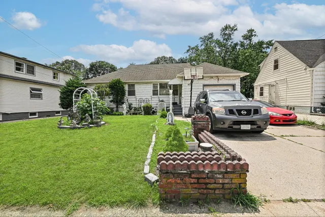 a front view of a house with garden