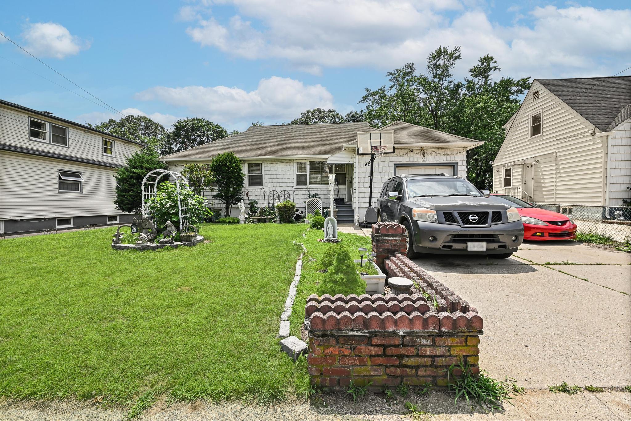 a front view of a house with garden