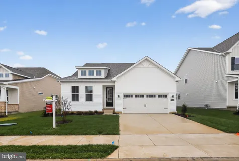 a view of a yard in front of a house with a yard