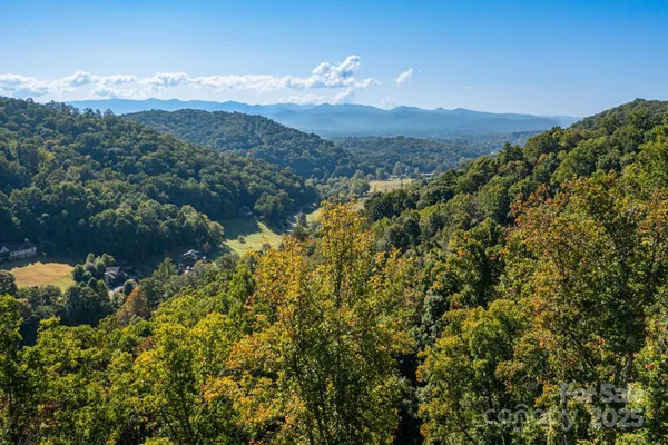 a view of a town with mountains in the background