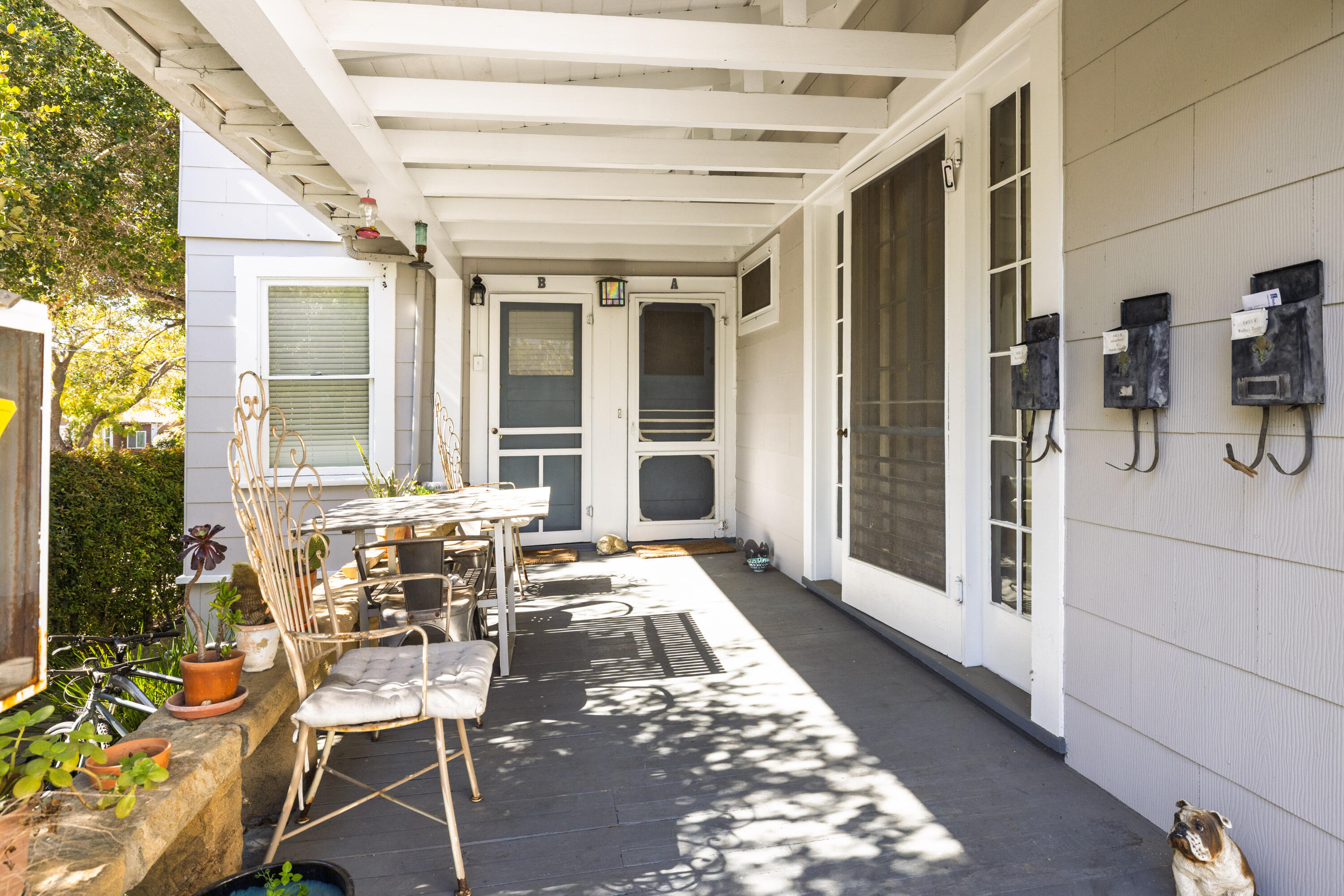 1403 Bath Street Santa Barbara, CA 93101 - Photo 11 of 24 a view of a patio with table and chairs and potted plants