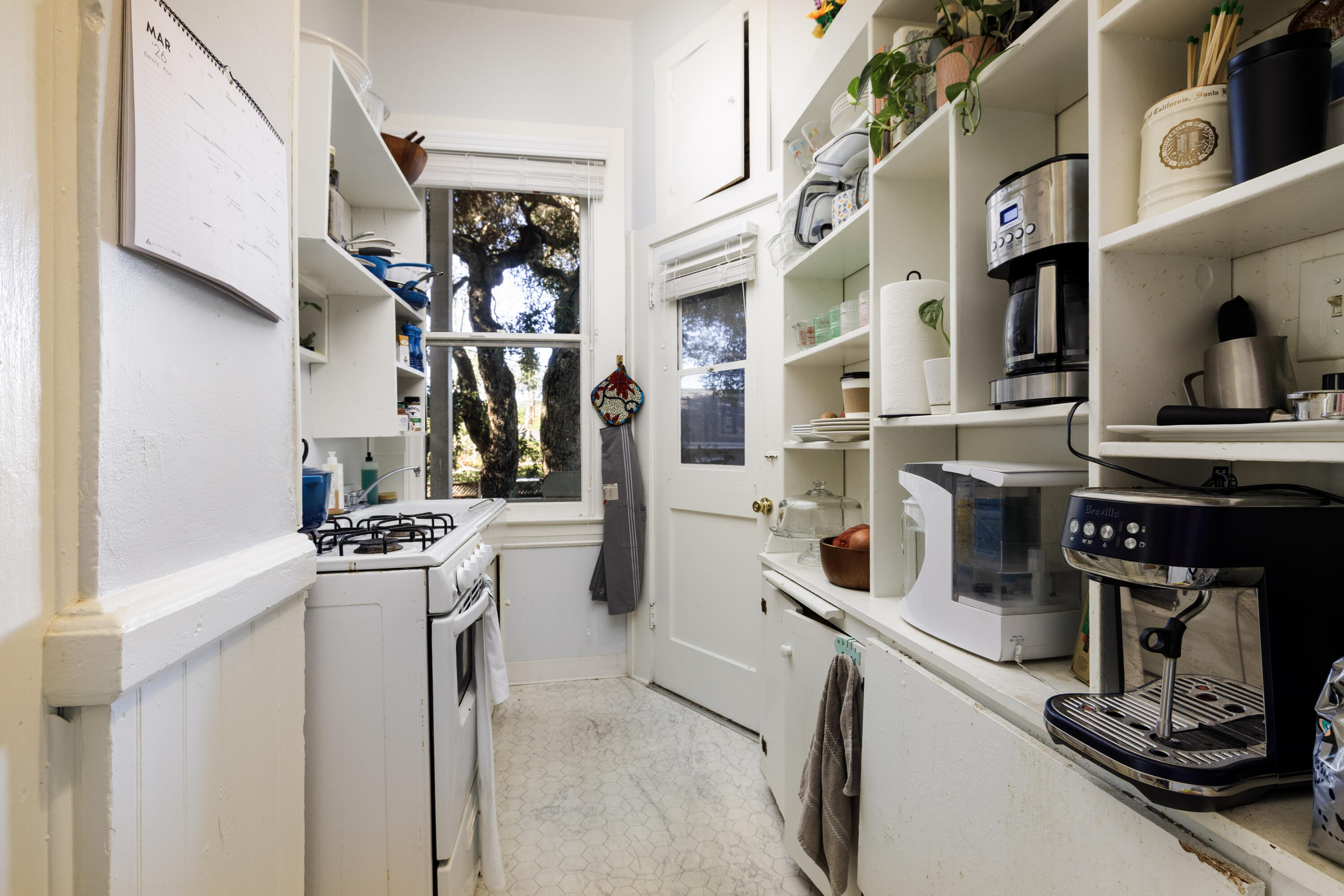 1403 Bath Street Santa Barbara, CA 93101 - Photo 14 of 24 a kitchen with stainless steel appliances granite countertop a stove and cabinets