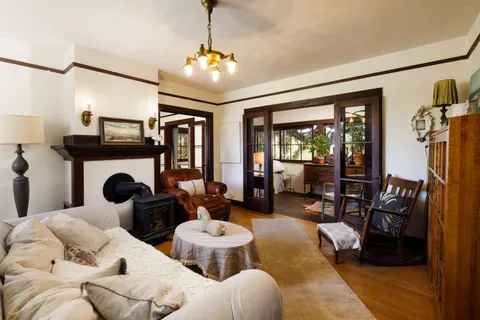 a living room with furniture and lamp