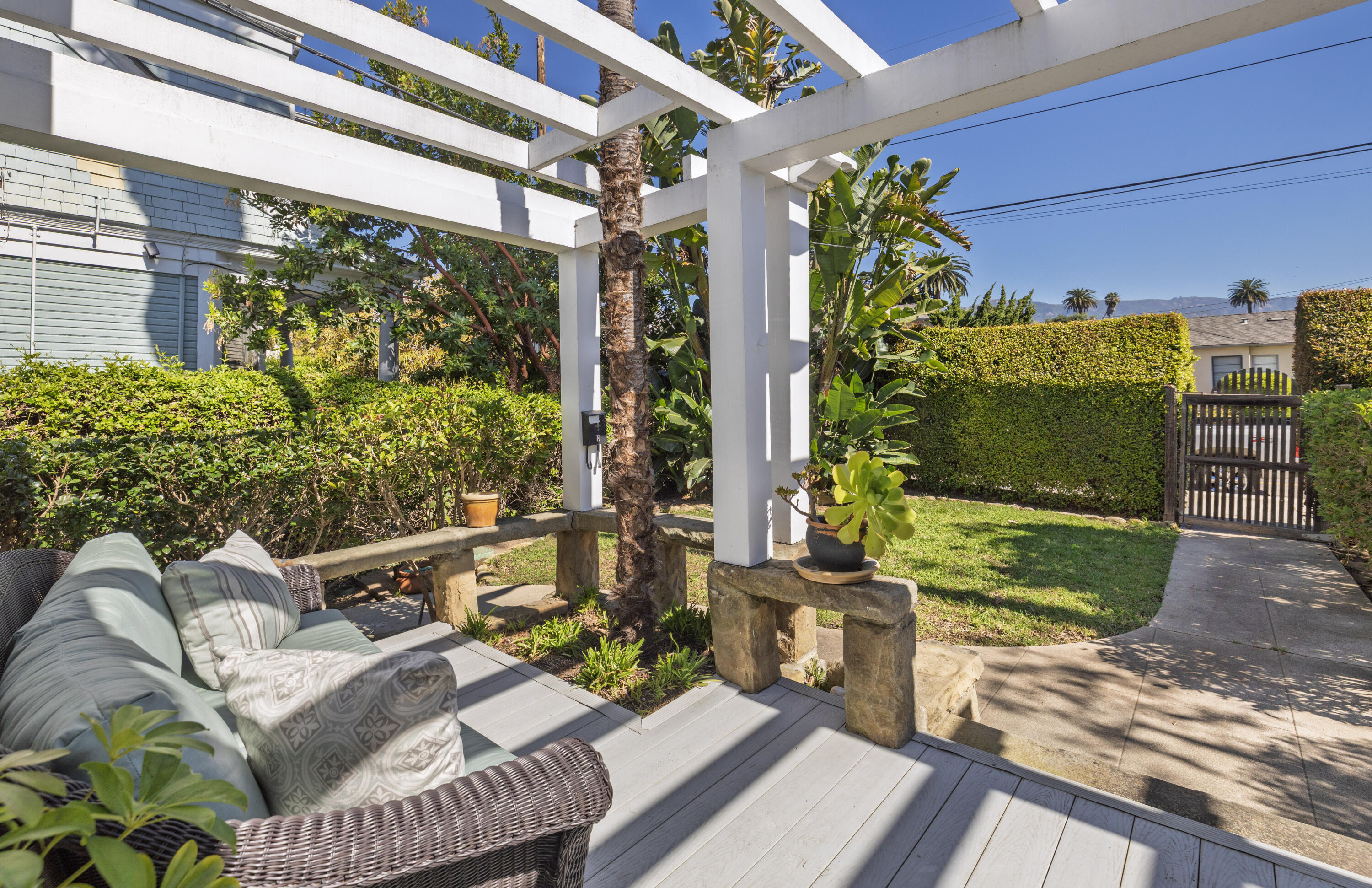 1403 Bath Street Santa Barbara, CA 93101 - Photo 22 of 24 a view of a porch with furniture and a yard
