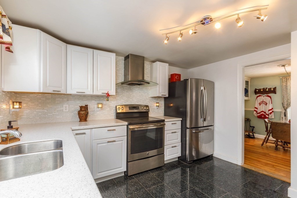 46 Bickford Hill Road Gardner, MA 01440 - Photo 2 of 19 a kitchen with stainless steel appliances granite countertop a refrigerator sink and stove