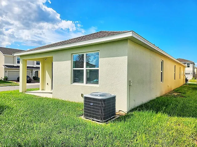 a backyard of a house with fountain