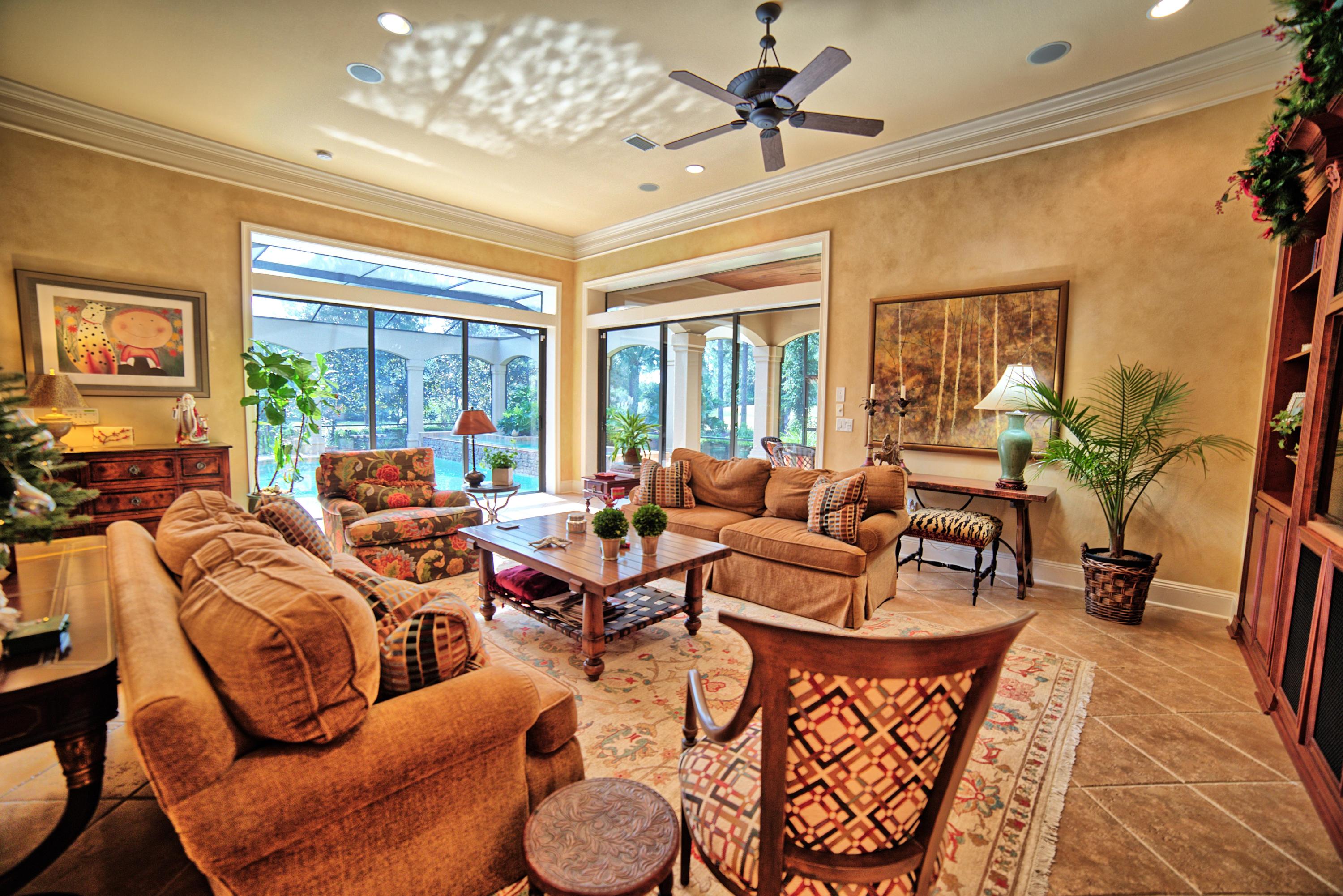 3594 Preserve Lane Miramar Beach, FL 32550 - Photo 13 of 35 a living room with furniture chandelier and a large window