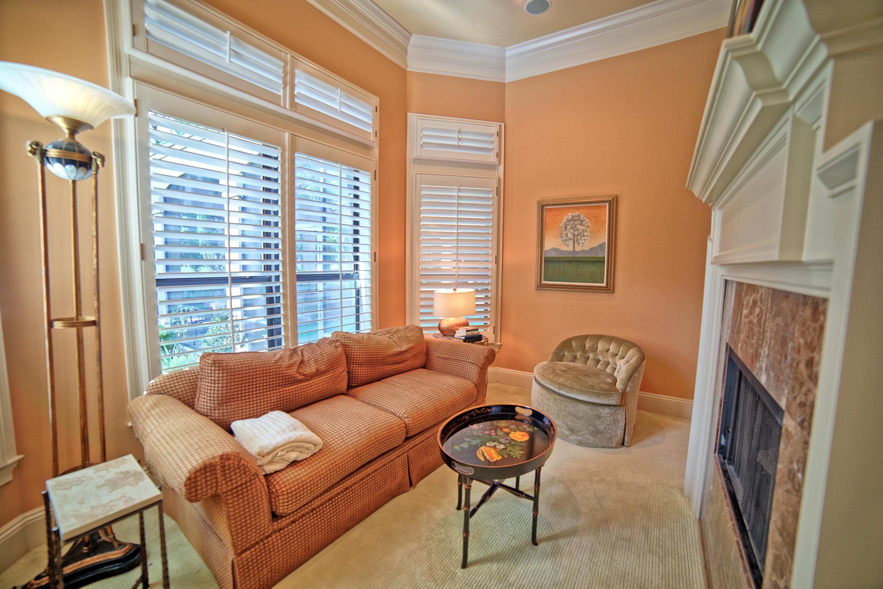 3594 Preserve Lane Miramar Beach, FL 32550 - Photo 15 of 35 a living room with furniture a fireplace and a large window