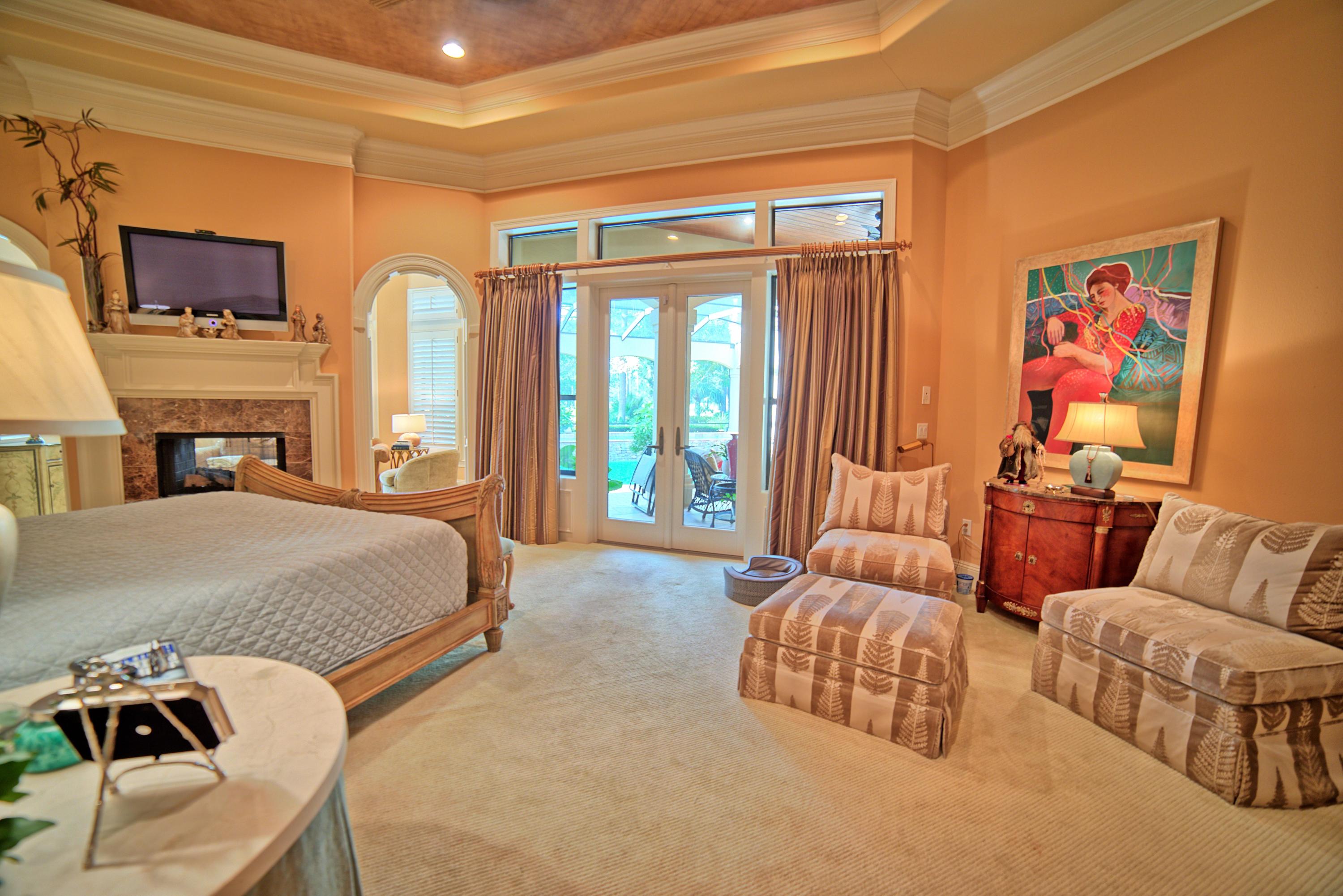 3594 Preserve Lane Miramar Beach, FL 32550 - Photo 16 of 35 a bedroom with furniture and a fireplace