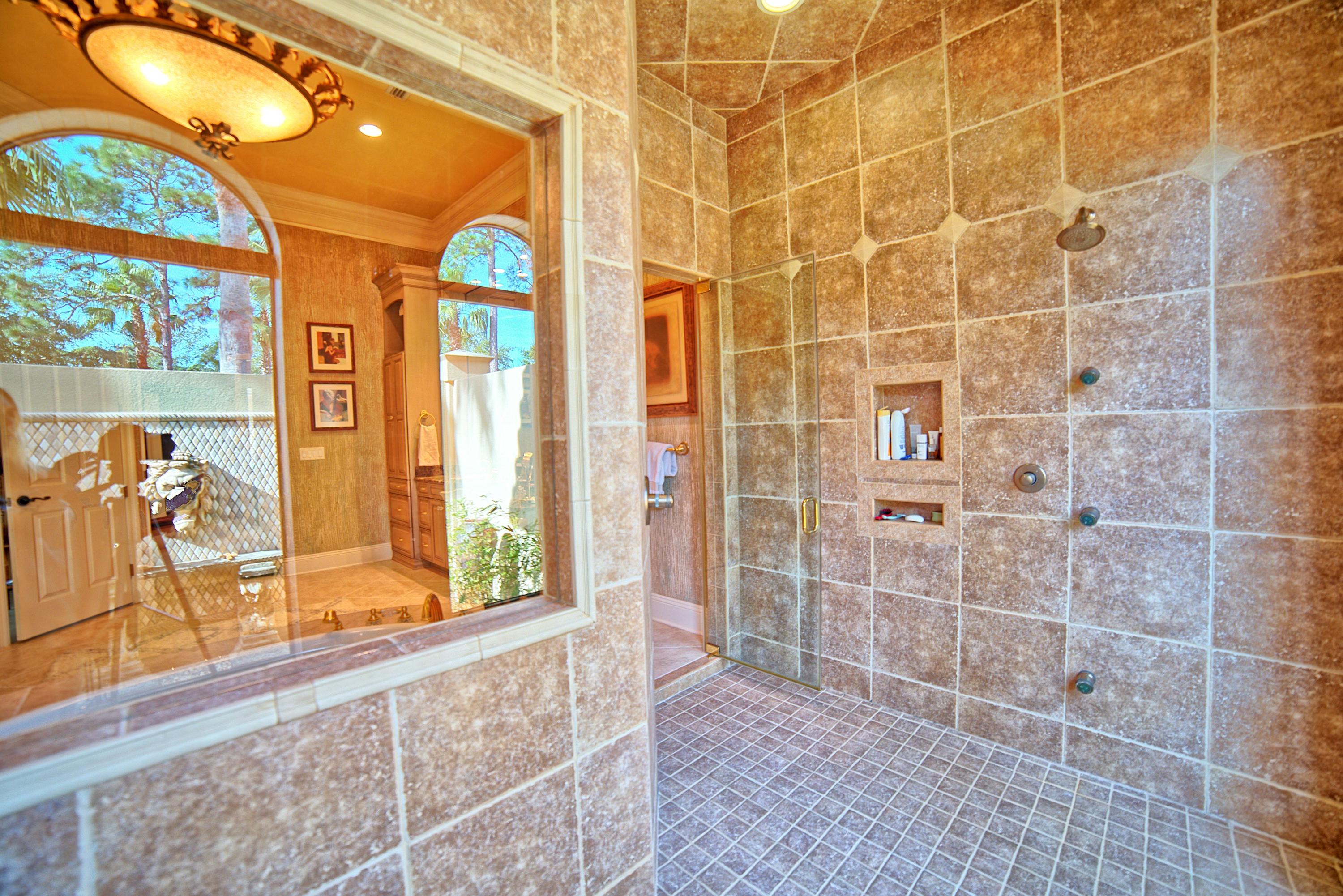 3594 Preserve Lane Miramar Beach, FL 32550 - Photo 19 of 35 a view of a bathroom with a bathtub and a shower