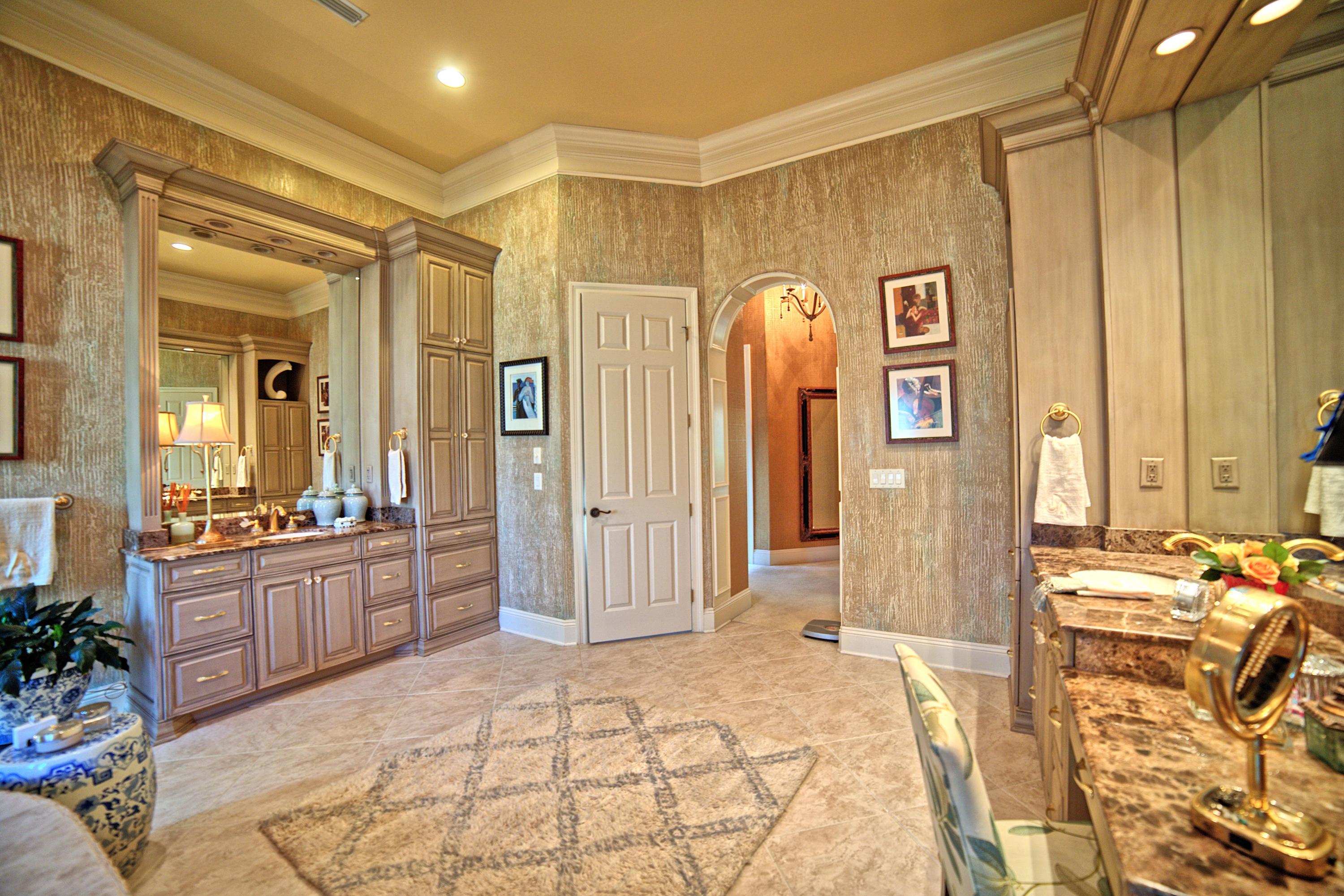 3594 Preserve Lane Miramar Beach, FL 32550 - Photo 20 of 35 a spacious bathroom with a granite countertop sink a mirror a bathtub and shower