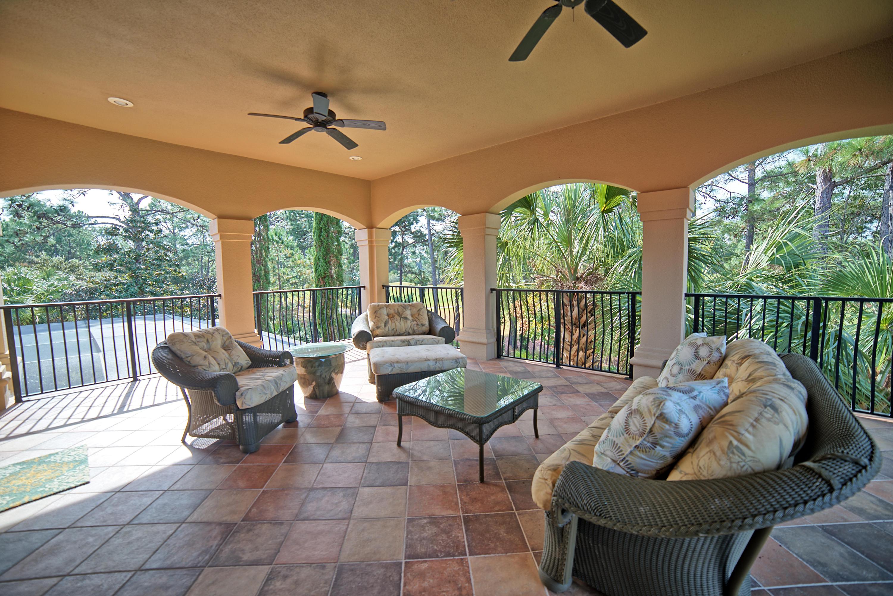 3594 Preserve Lane Miramar Beach, FL 32550 - Photo 27 of 35 a living room with furniture and a floor to ceiling window