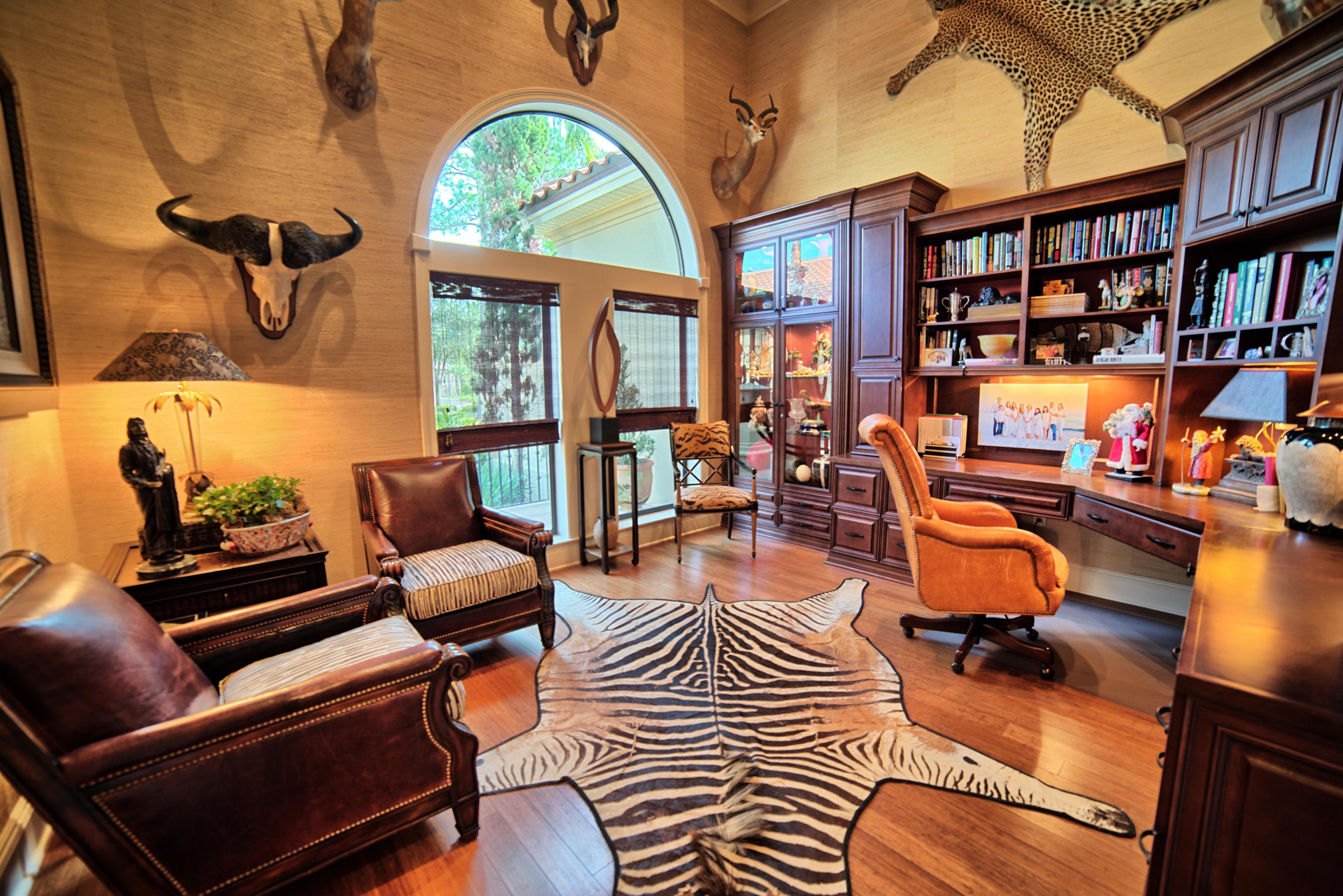 3594 Preserve Lane Miramar Beach, FL 32550 - Photo 4 of 35 a living room with furniture a bookshelf and a window