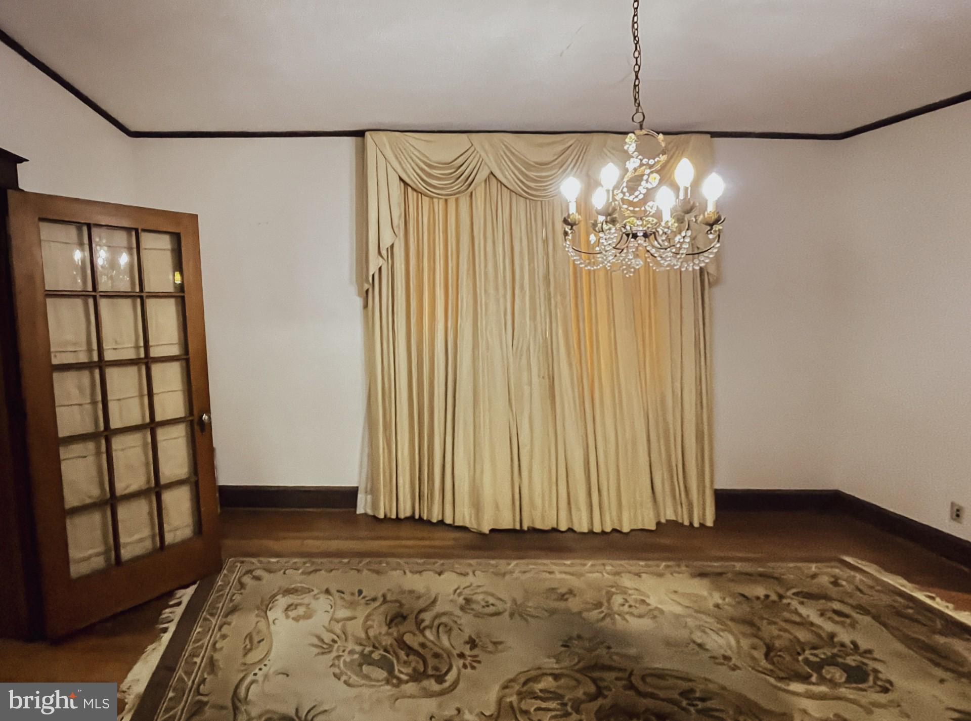121 Raleigh Street Southeast Washington, DC 20032 - Photo 14 of 21 a view of a livingroom with a chandelier fan and wooden floor