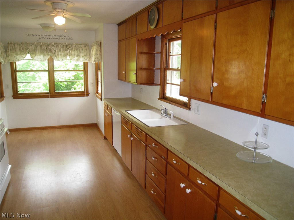 Laminate flooring and Dining area in spacious Kitchen, with all Appliances for new owner!