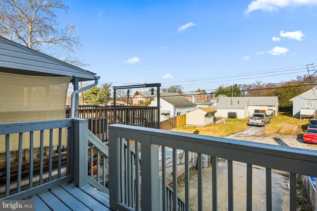 a front view of a residential apartment building with a yard