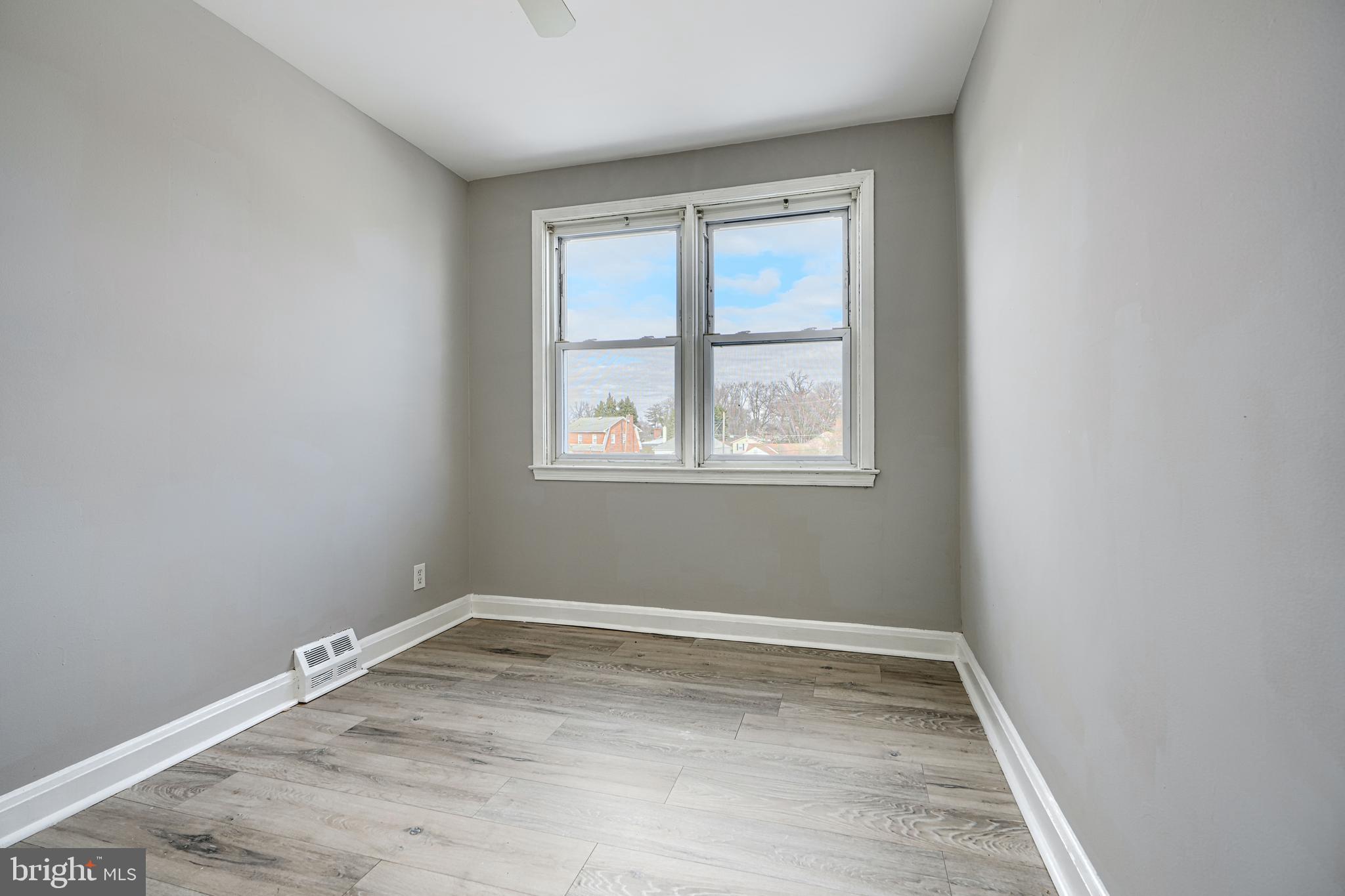 165 Hampshire Road Essex, MD 21221 - Photo 14 of 40 an empty room with a window