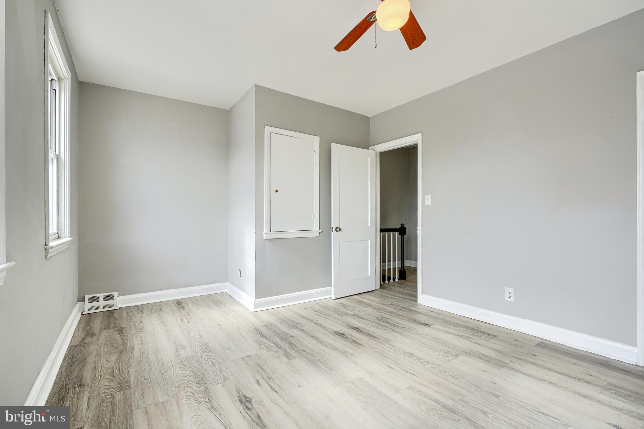 165 Hampshire Road Essex, MD 21221 - Photo 18 of 40 a view of an empty room with wooden floor