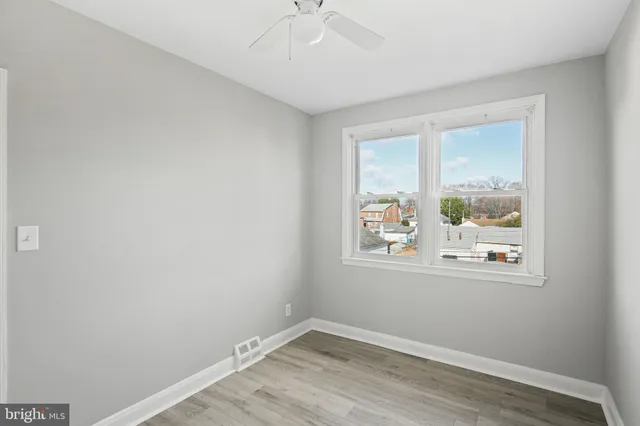 a view of a livingroom with wooden floor