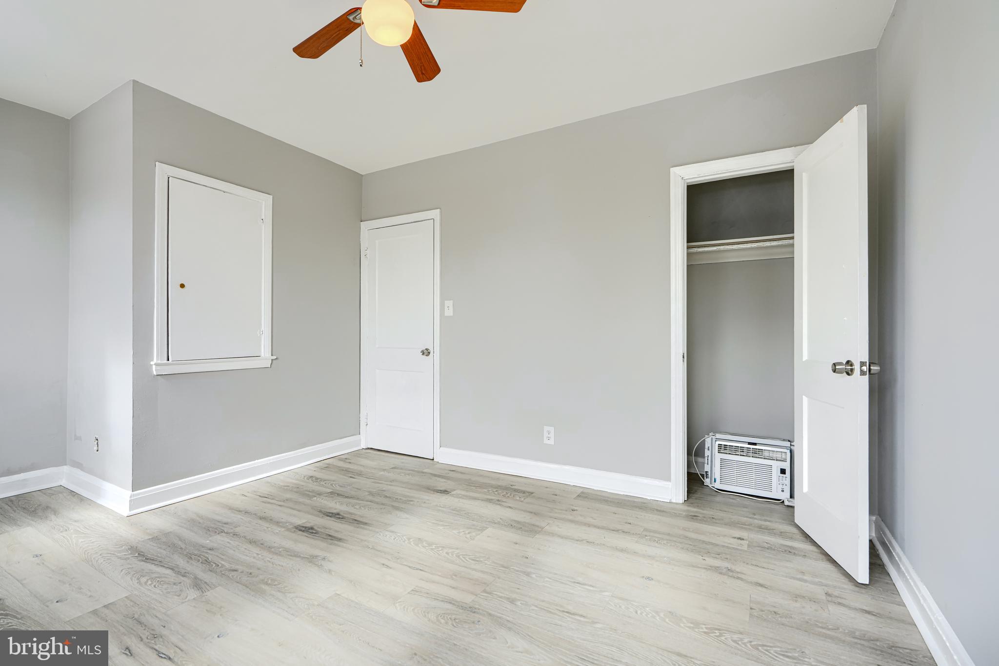 165 Hampshire Road Essex, MD 21221 - Photo 20 of 40 a view of an empty room with a ceiling fan