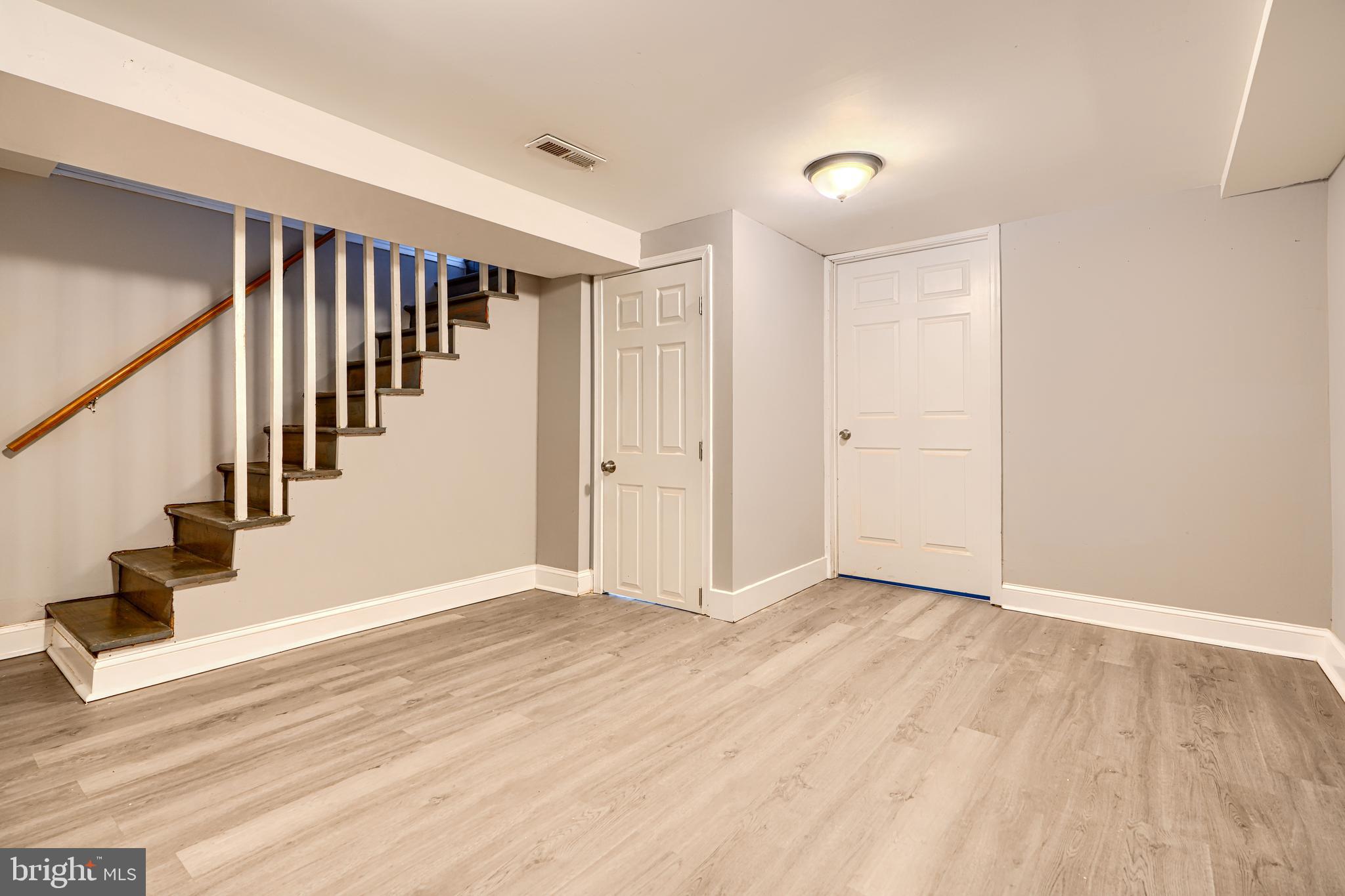 165 Hampshire Road Essex, MD 21221 - Photo 25 of 40 a view of an entryway with wooden floor and stairs