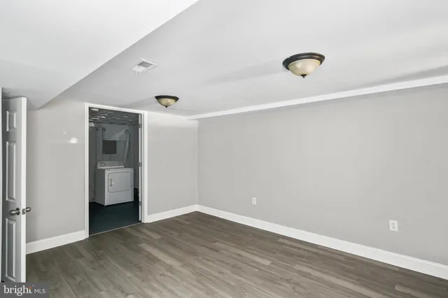 a view of a room with wooden floor and stairs