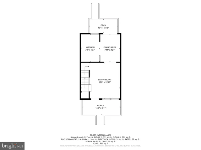 a view of empty room with wooden floor and stairs