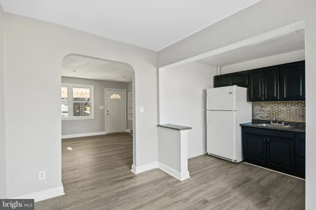 a white refrigerator freezer sitting in a kitchen