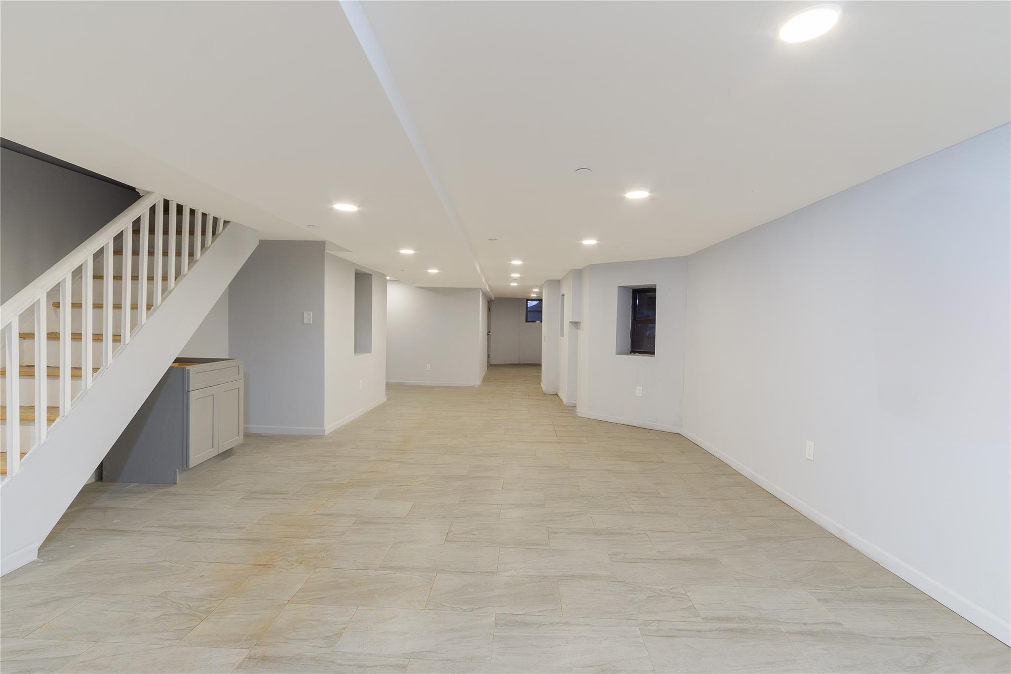 1102 Jackson Avenue Bronx, NY 10456 - Photo 34 of 36 a view of an empty room with stairs