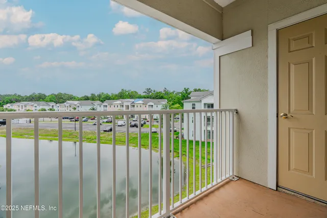 an aerial view of lake residential house with outdoor space