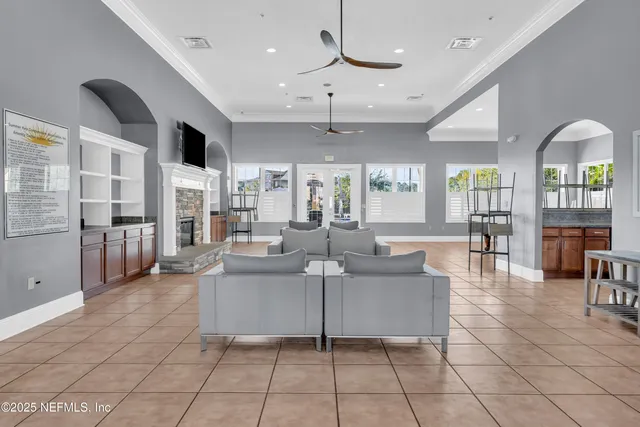 a room with gym equipment and windows