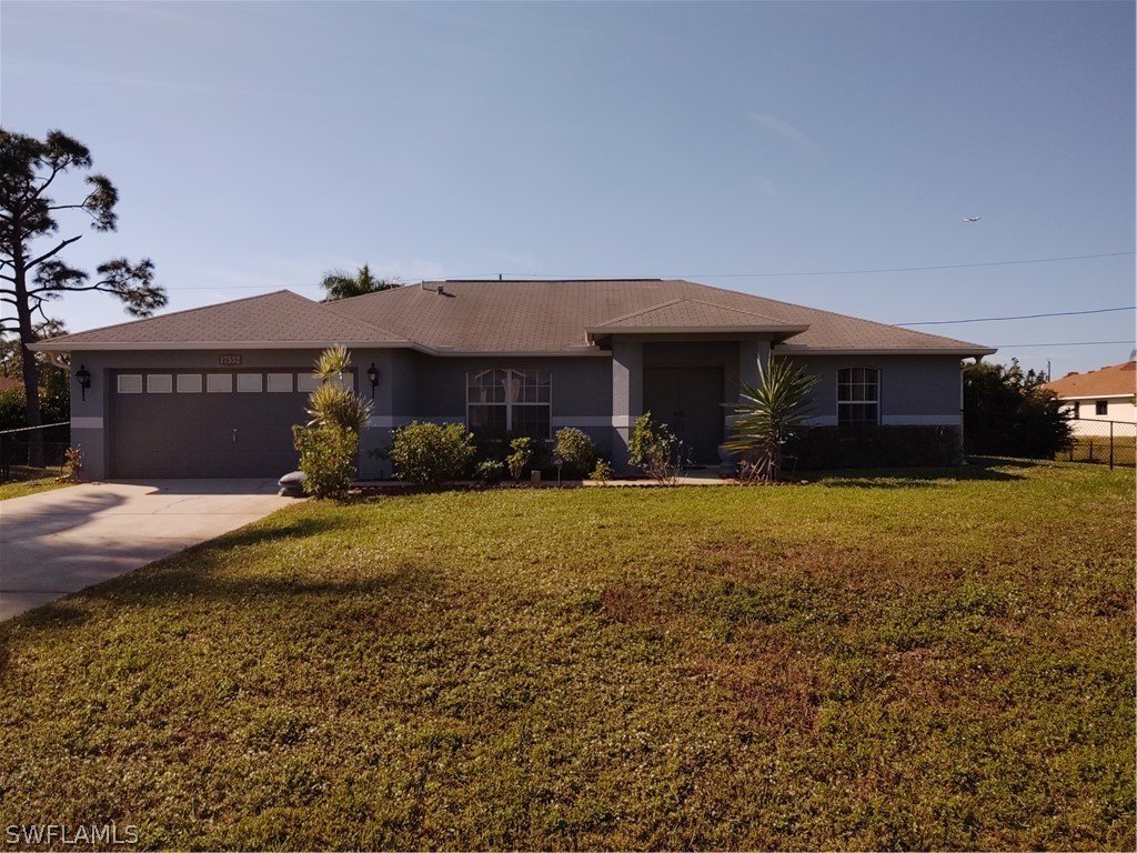 17532 Butler Road Fort Myers, FL 33967 - Photo 1 of 29 a front view of a house with garden