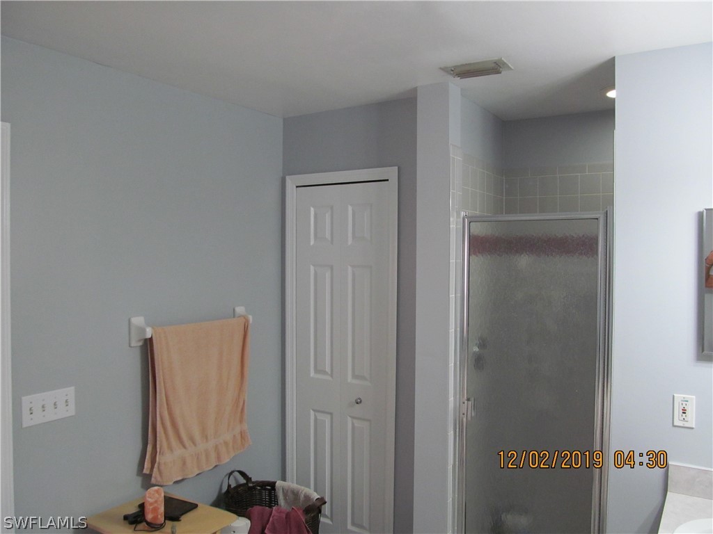 17532 Butler Road Fort Myers, FL 33967 - Photo 16 of 29 a view of hallway with table and chair
