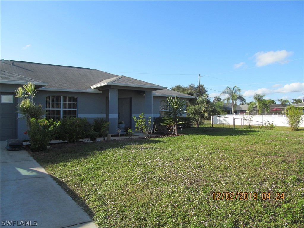 17532 Butler Road Fort Myers, FL 33967 - Photo 2 of 29 a front view of a house with garden