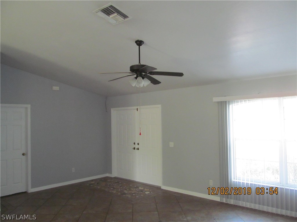 17532 Butler Road Fort Myers, FL 33967 - Photo 5 of 29 an empty room with a window