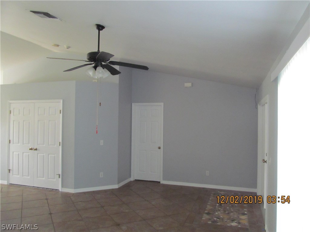 17532 Butler Road Fort Myers, FL 33967 - Photo 6 of 29 a view of an empty room and chandelier fan