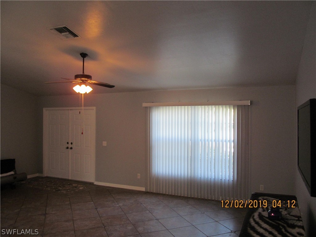 17532 Butler Road Fort Myers, FL 33967 - Photo 7 of 29 a view of an empty room with a window