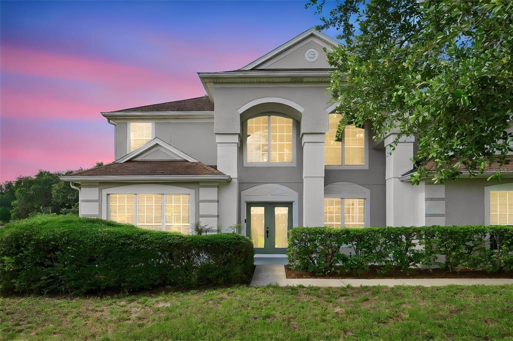 936 Kingsridge Circle Gotha, FL 34734 - Photo 35 of 50 a front view of a house with a garden