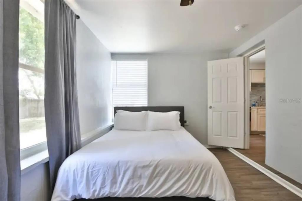 3113 McIntosh Road Sarasota, FL 34232 - Photo 14 of 22 a bedroom with a bed and a window