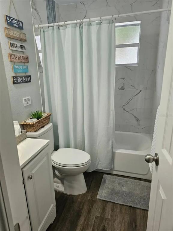 3113 McIntosh Road Sarasota, FL 34232 - Photo 17 of 22 a bathroom with a sink toilet and shower