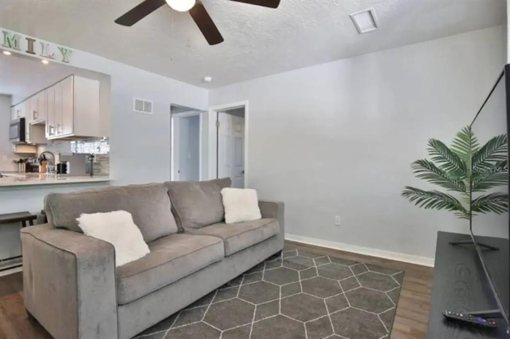 3113 McIntosh Road Sarasota, FL 34232 - Photo 19 of 22 a living room with furniture and a potted plant