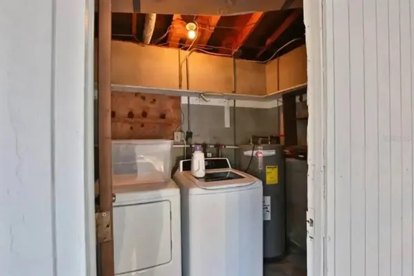 a view of storage and utility room with washer and dryer