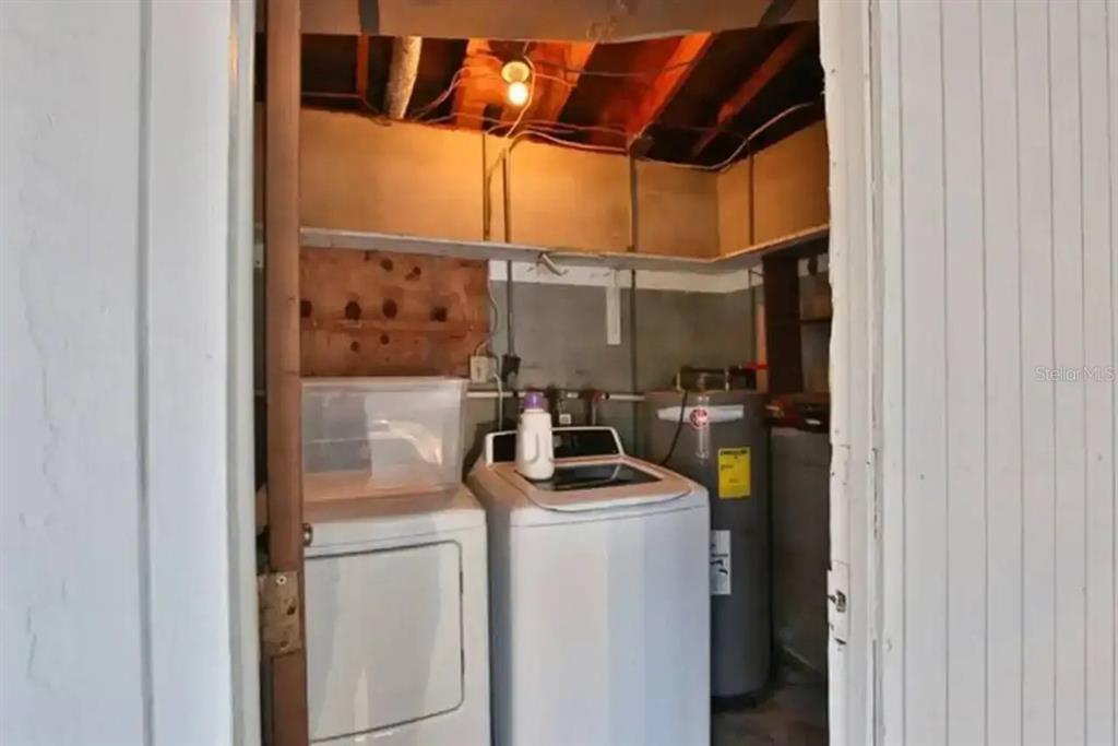 3113 McIntosh Road Sarasota, FL 34232 - Photo 22 of 22 a view of storage and utility room with washer and dryer