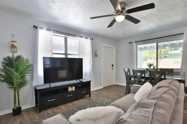 a living room with furniture and a flat screen tv