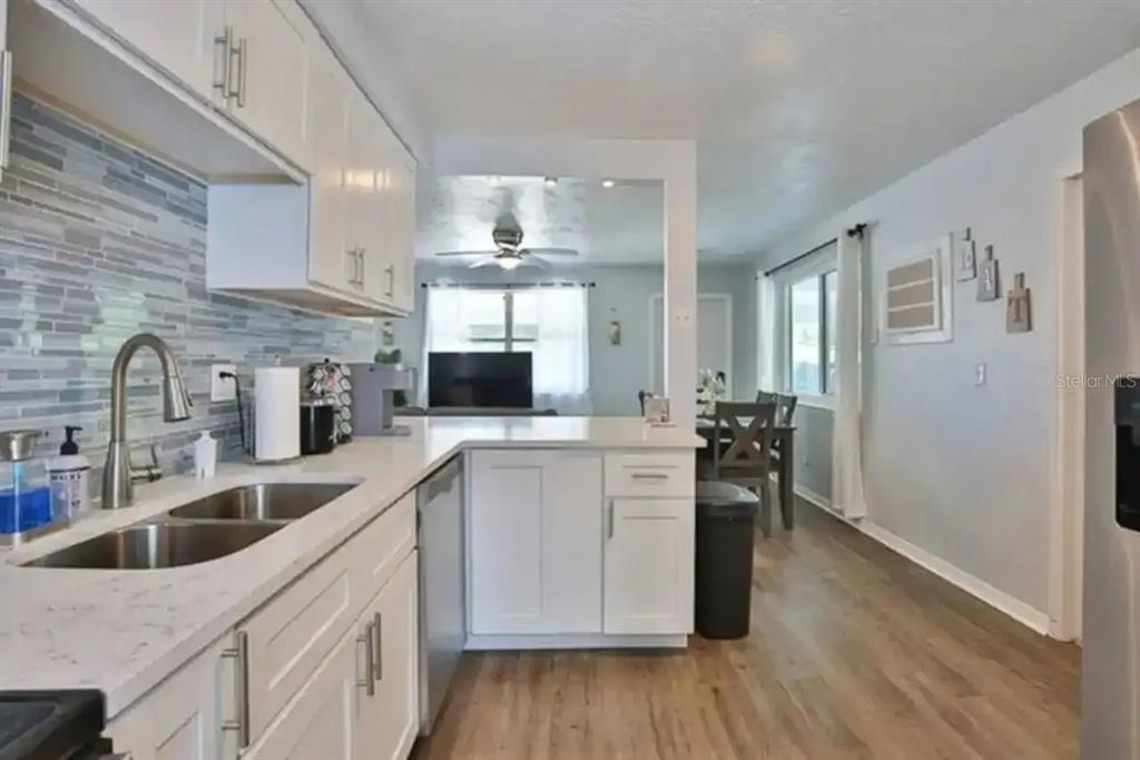 3113 McIntosh Road Sarasota, FL 34232 - Photo 10 of 22 a kitchen with cabinets a sink and appliances