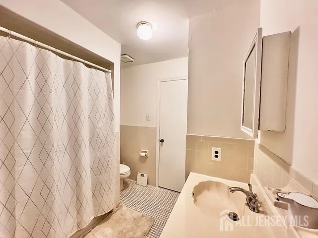 a bathroom with a bathtub and a sink